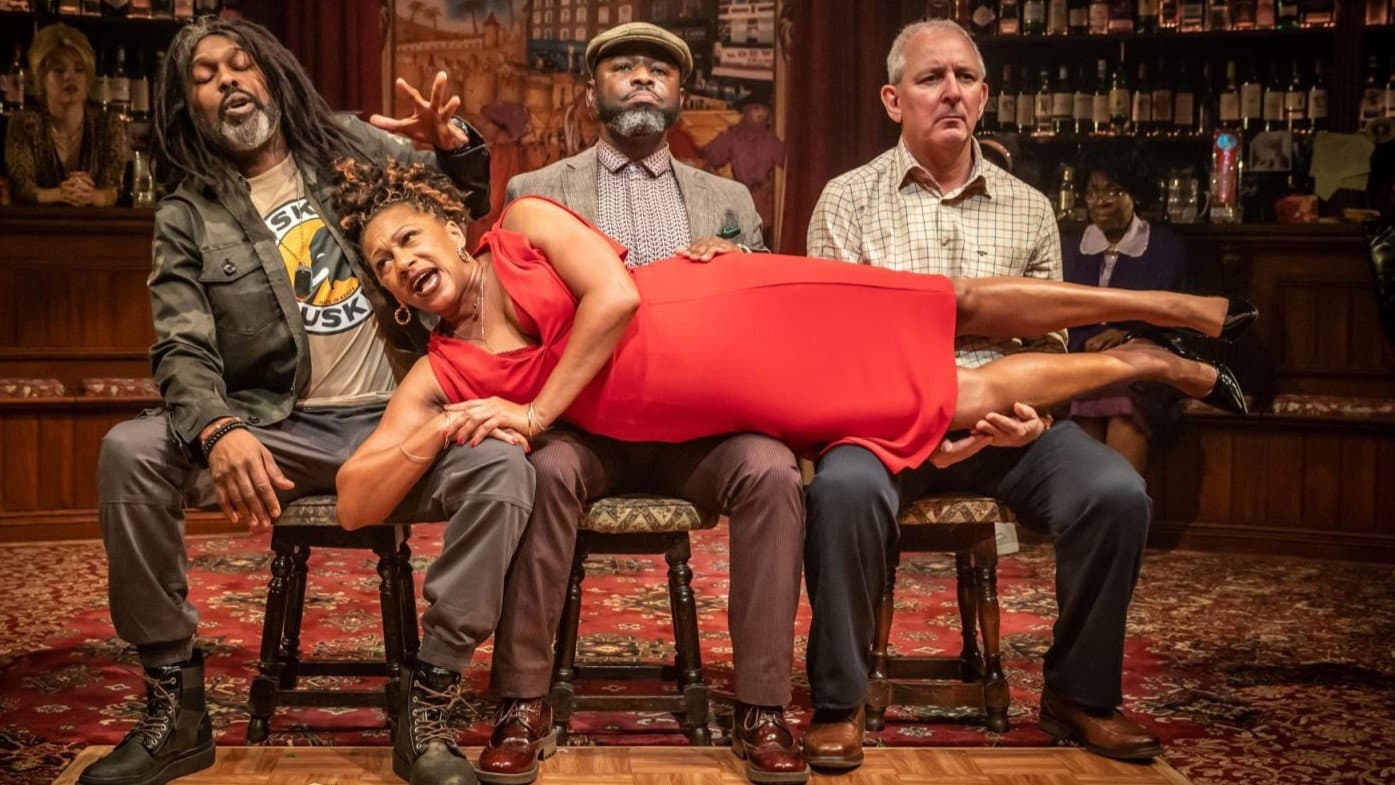 National Theatre Live: The Wife of Willesden backdrop