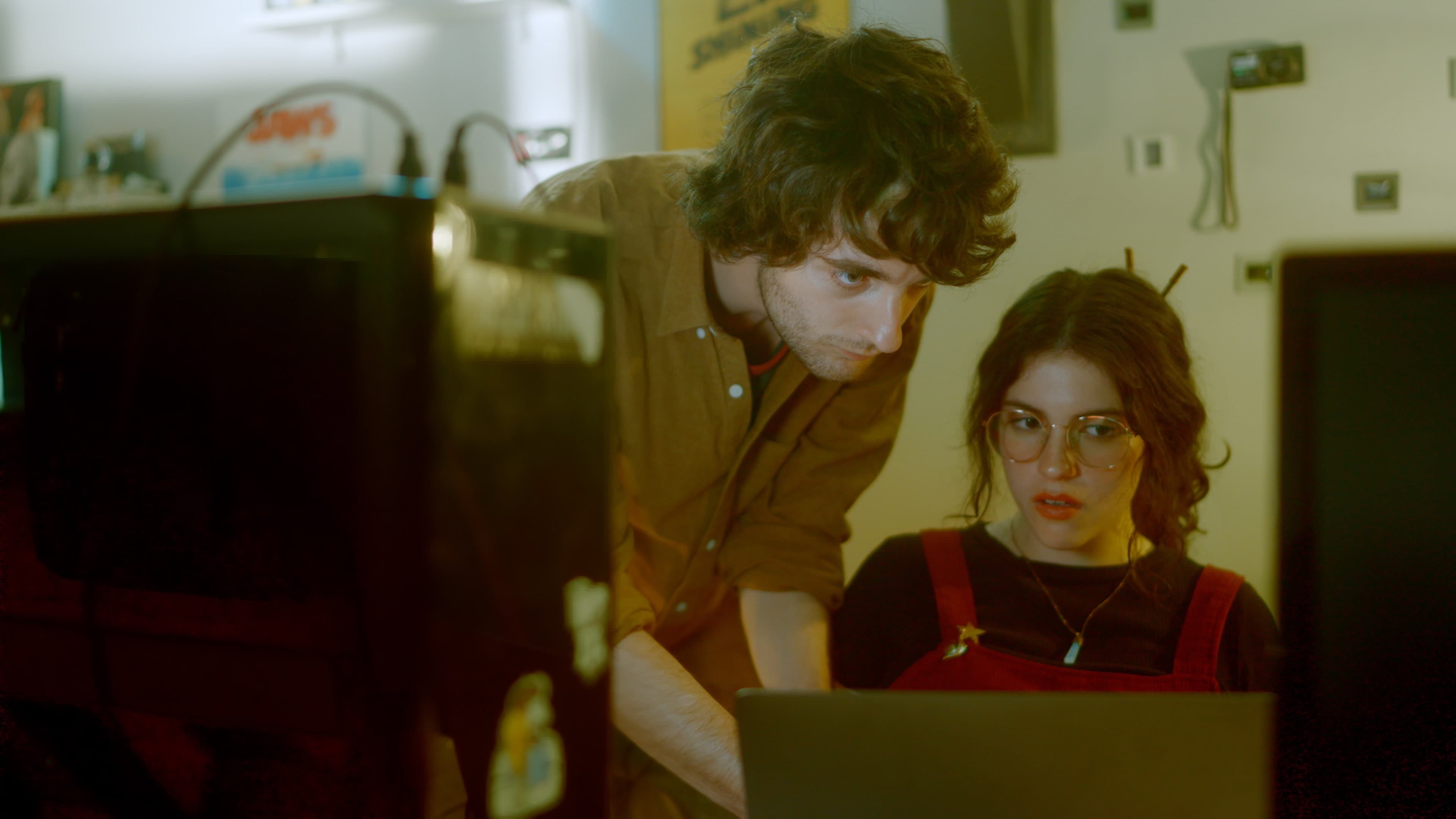 The green silhouette backdrop